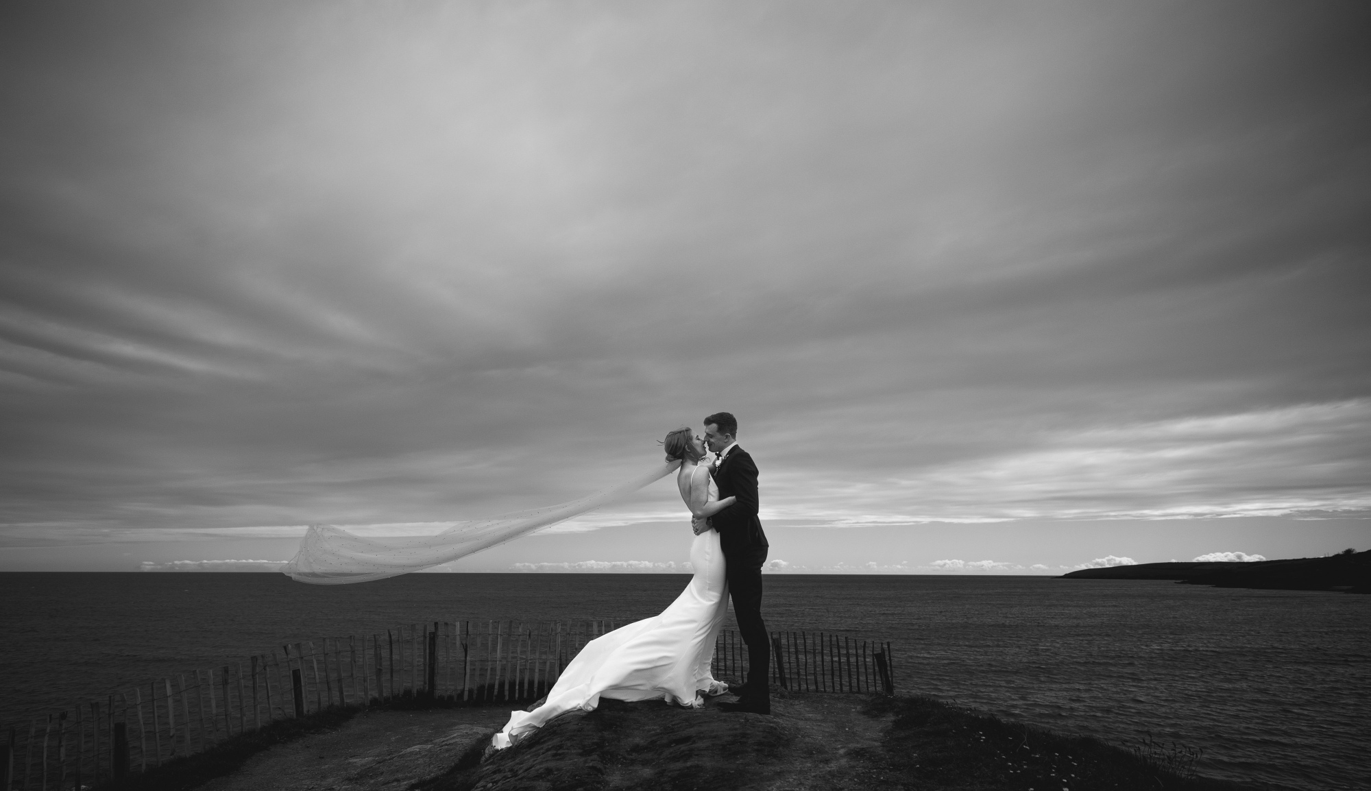 black and white headland at dusk